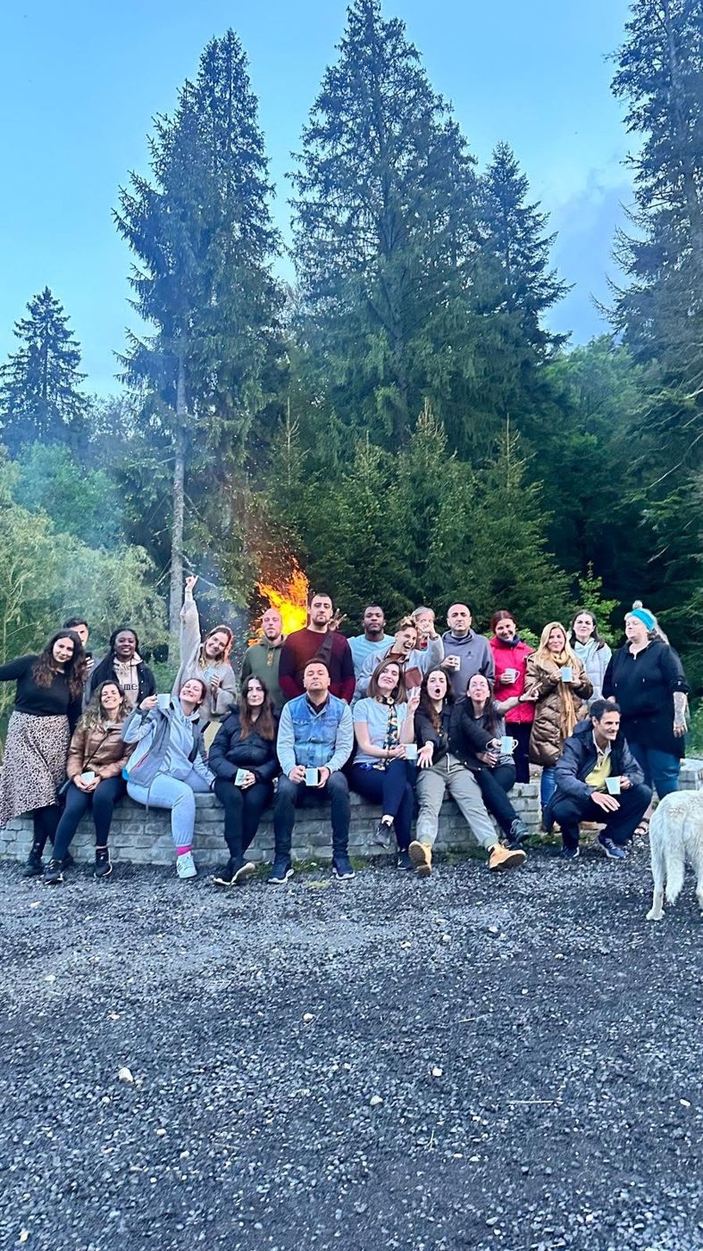 Project participants around a campfire